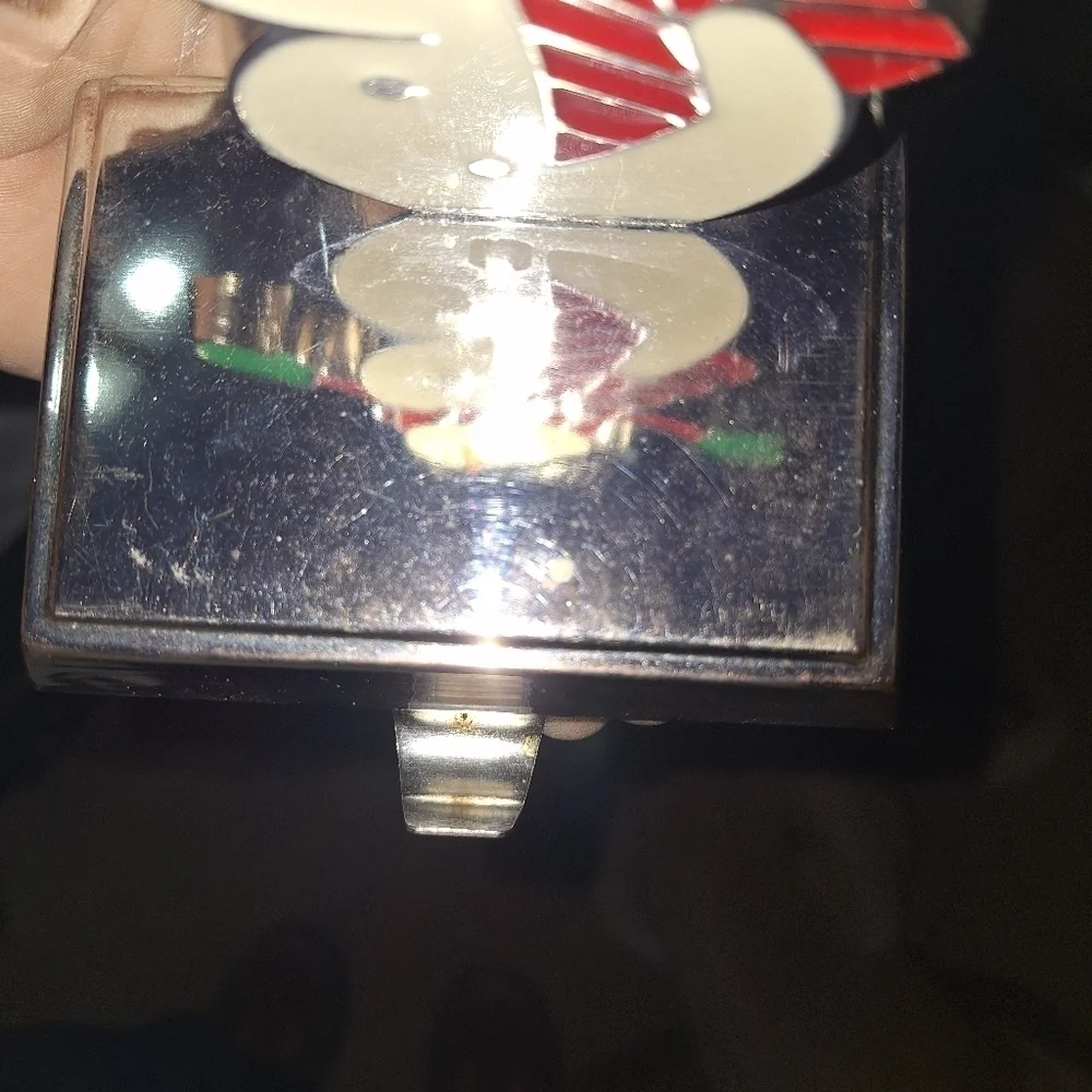 An unbranded Penguin Stocking Holder    It's base is 4